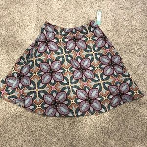 Knee-length pastel patterned skirt